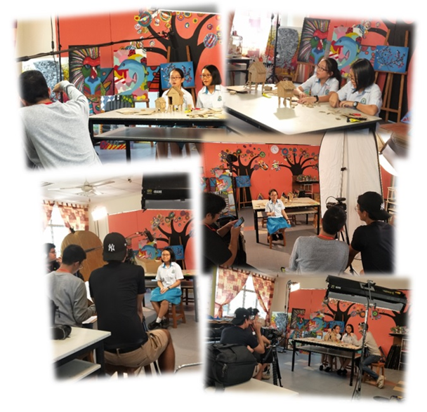 Four photos show students being filmed and photographed in a colorful art classroom with bright painted murals.